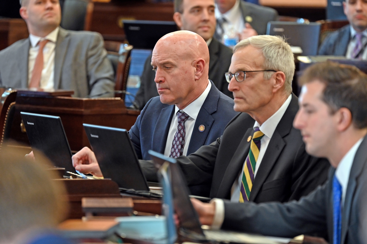 State Representative Bernie Willis looks over legislation on the House floor during session.