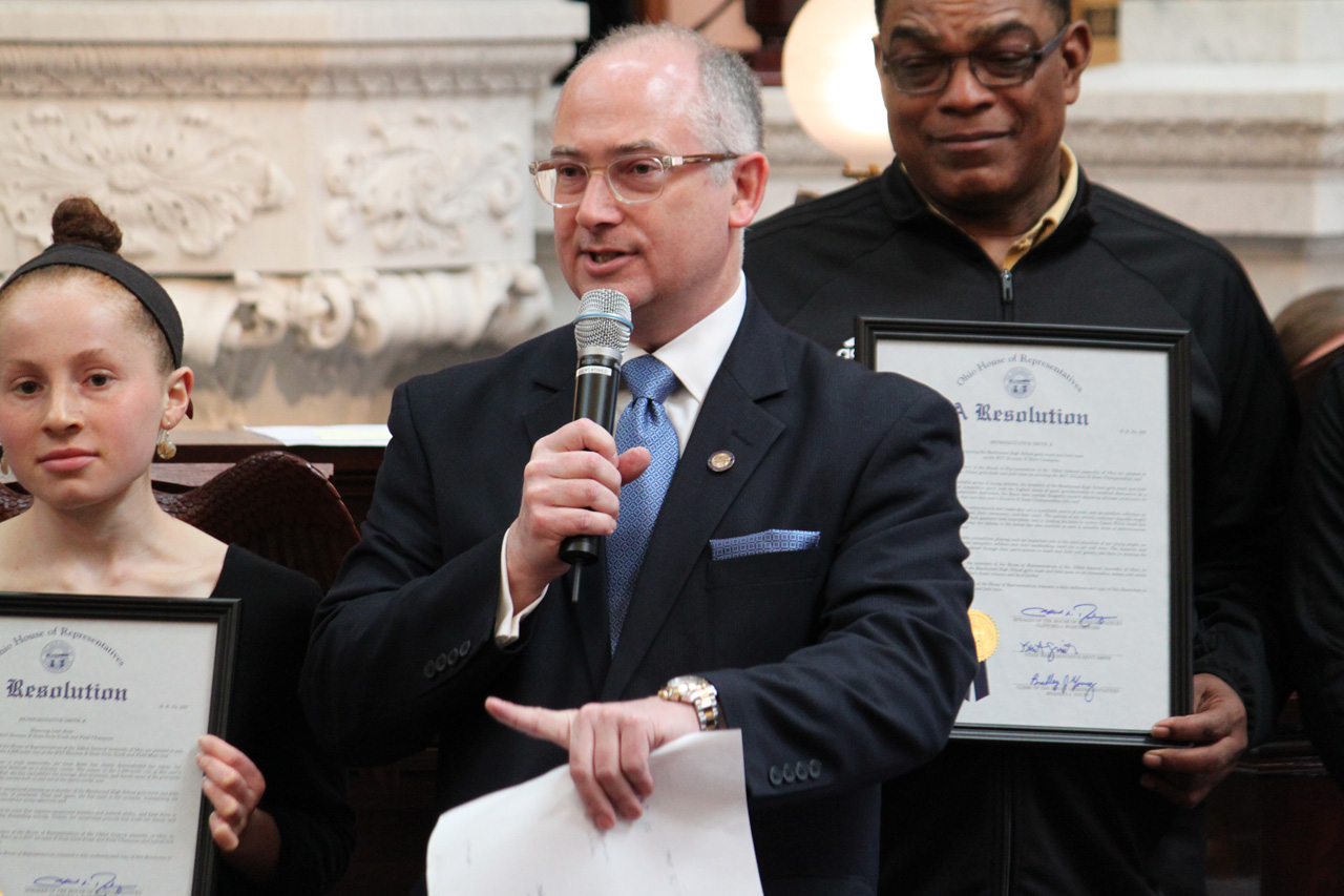 Rep. Smith presenting a House Resolution to the Beachwood Girls' Track and Field Team