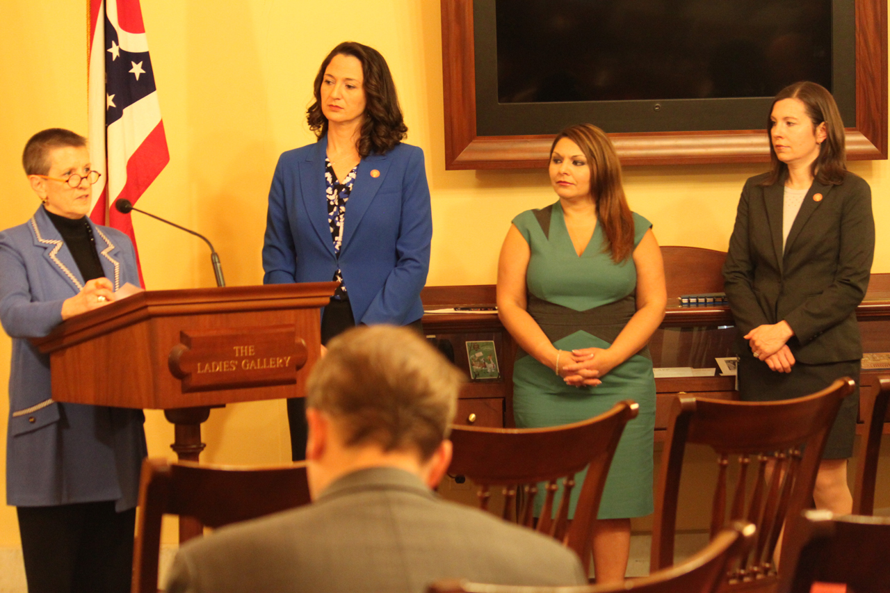 Rep. Boggs standing with women lawmakers at a news conference to encourage more women in leadership