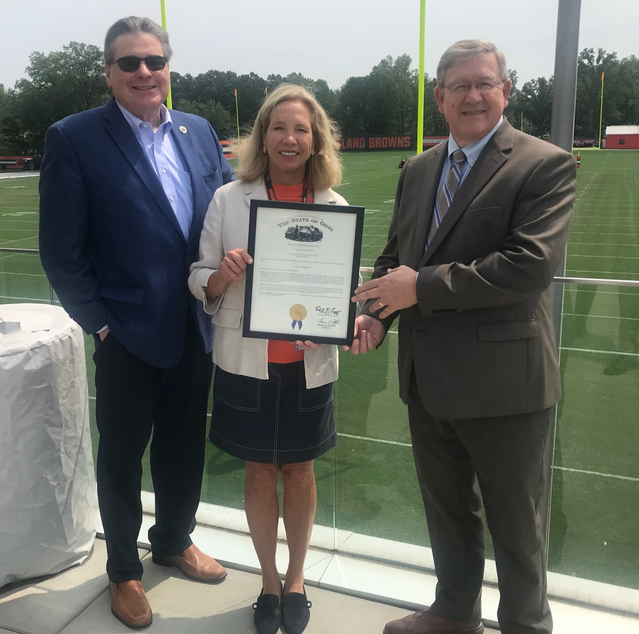 Rep. Patton and Speaker Cupp present a commendation to Cleveland Browns owner Dee Haslam.