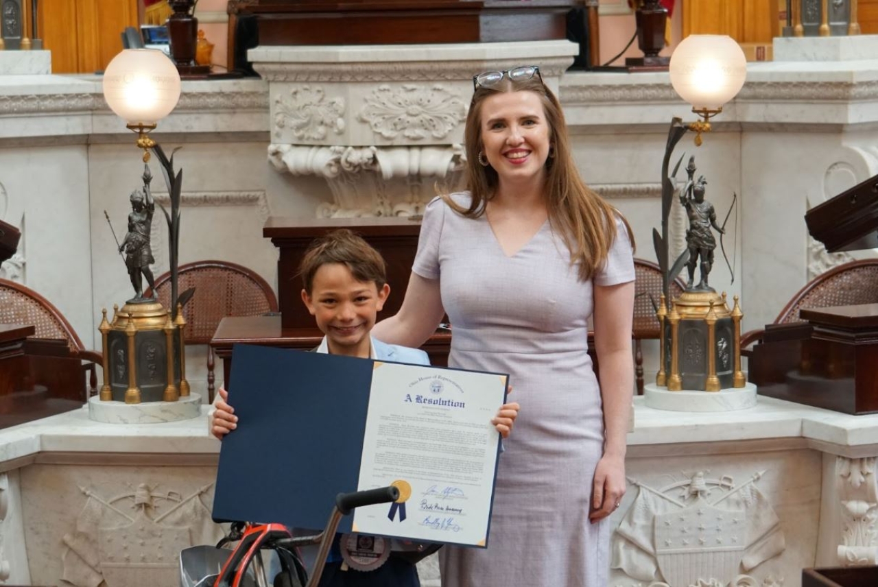 Rep Sweeney presents an Ohio House Resolution honoring Huck Kurinsky of Bay Village, OH on winning his second consecutive USA BMX National Championship.