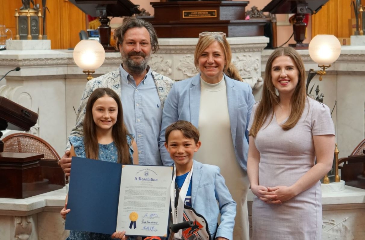 Rep Sweeney presents an Ohio House Resolution honoring Huck Kurinsky of Bay Village, OH on winning his second consecutive USA BMX National Championship.