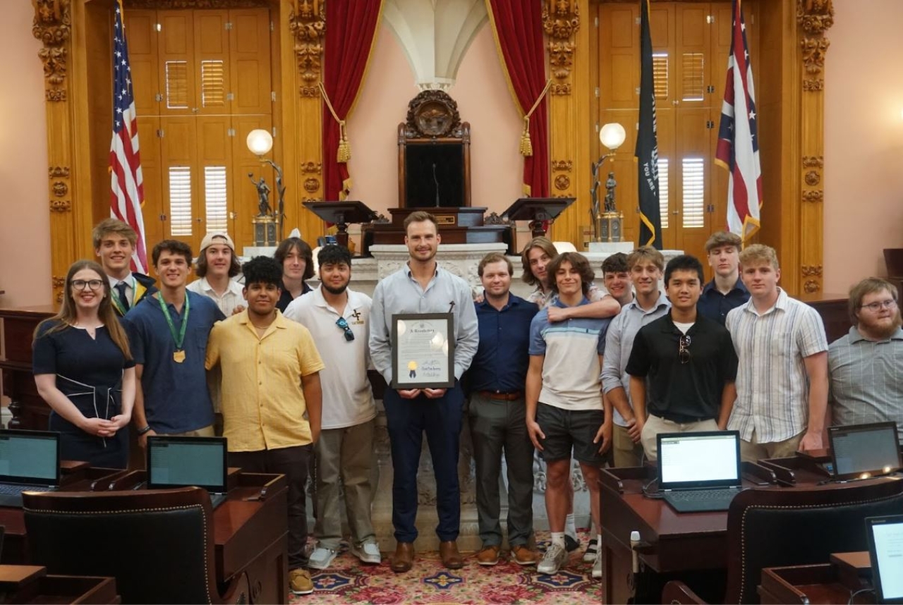 Rep Sweeney presents an Ohio House Resolution honoring the  Olmsted Falls Boys Lacrosse on winning the Division II state championship.