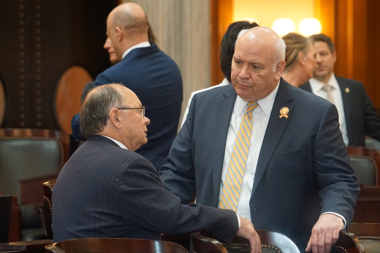 Rep. Skindell speaks with Rep. Mike Sheehy (D-Toledo) before House session