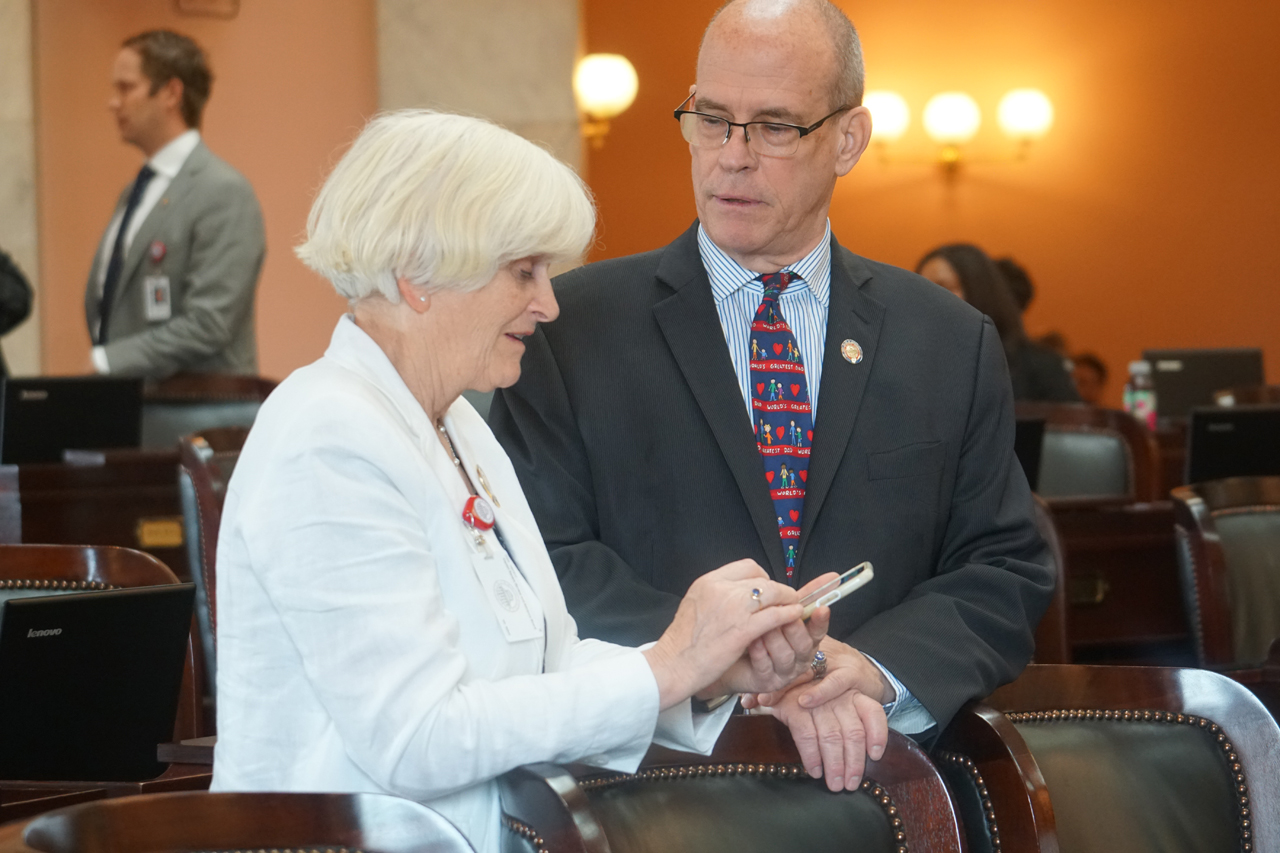 Rep. Lightbody speaks with Rep. Michael O'Brien (D-Warren) before House session