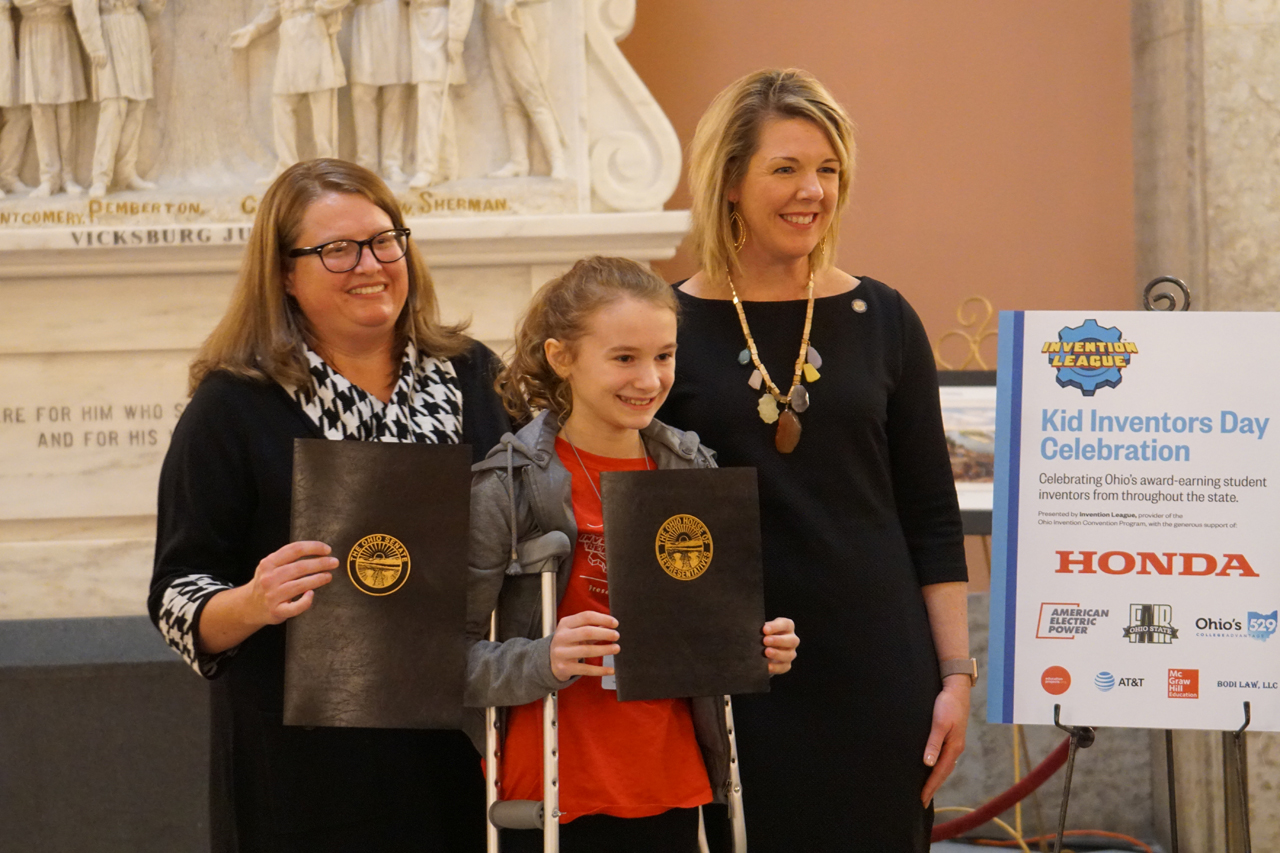 State Representative Allison Russo presents commendations to students participating in Kid Inventors Day at the Statehouse