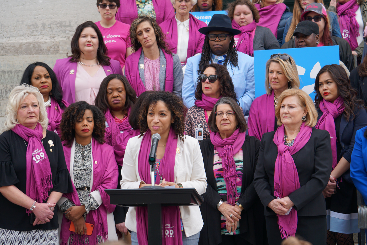Rep. Allison Russo (right) stands in solidarity with Ohio Democratic lawmakers at a press conference pushing back against Ohio's near total abortion ban