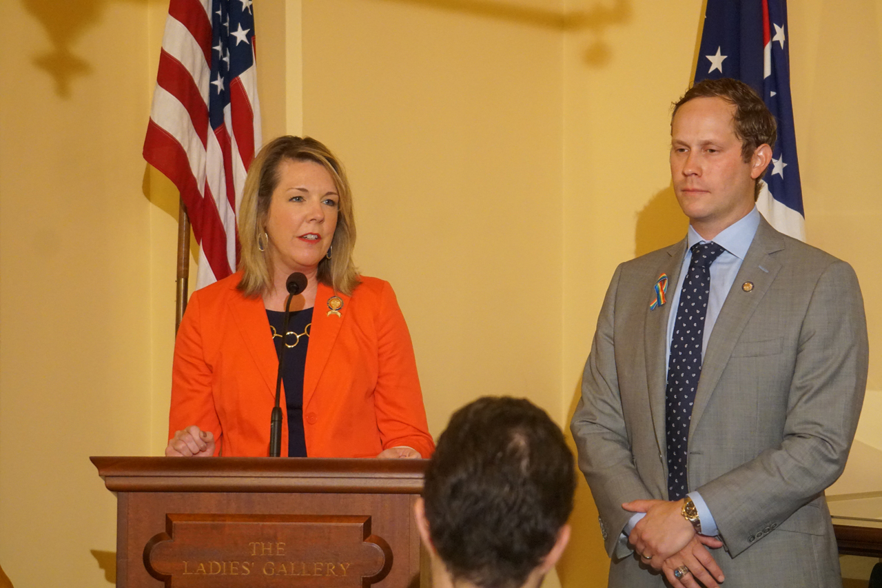 Rep. Russo speaks at a press conference on Madeline's Law, legislation to require health insurance coverage of hearing aids for children, alongside Rep. Casey Weinstein (D-Hudson)
