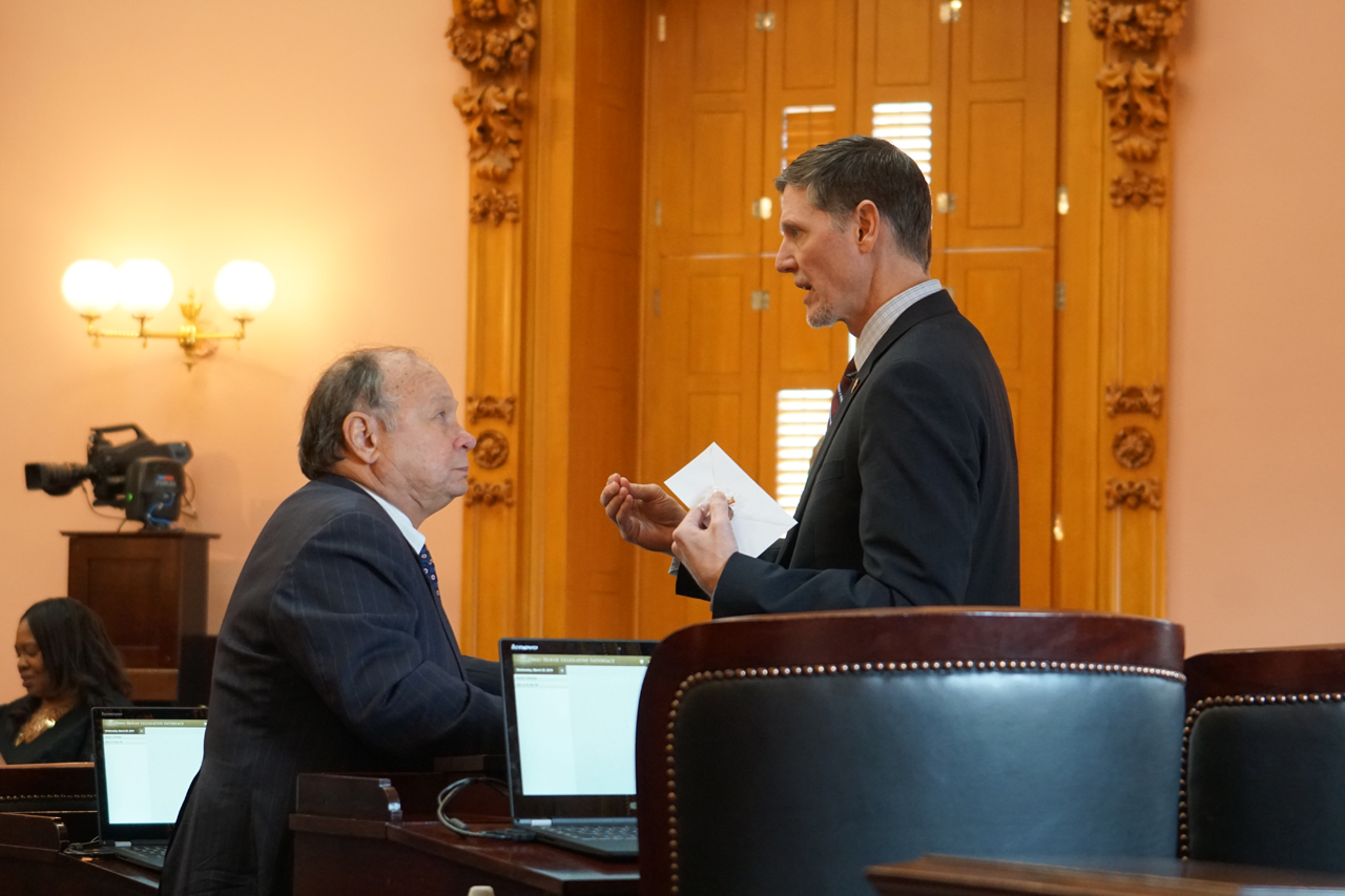 Rep. Miller talks with Rep. Michael Sheehy (D-Toledo) after House Session