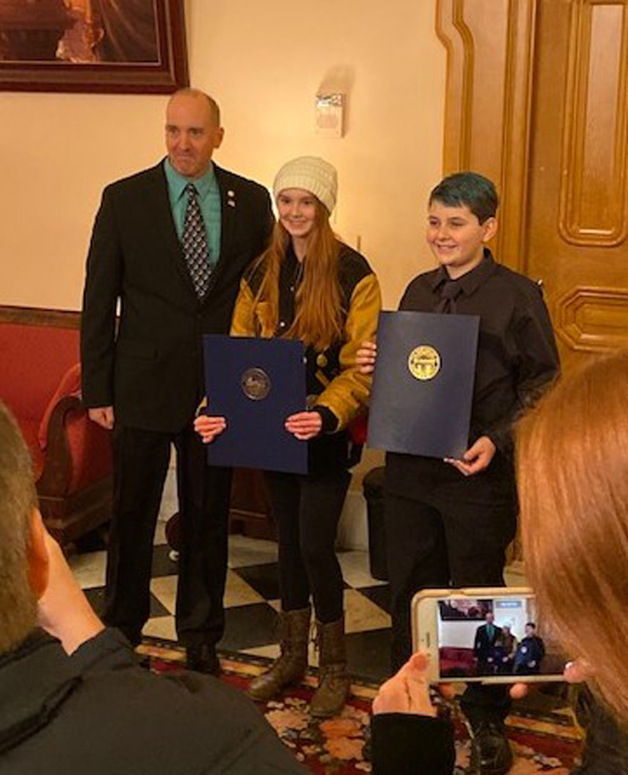 Rep. Holmes presents commendations to students Starley Jacobs and Mason Torres, winners of the Techcorps Hackathon.