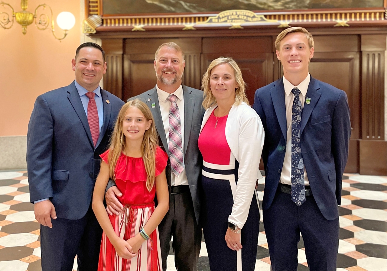 Rep. Ghanbari stands the with parents and their children of Bowling Green State University student Stone Foltz after the bill signing for Collin's Law: Ohio's Anti-Hazing Act.