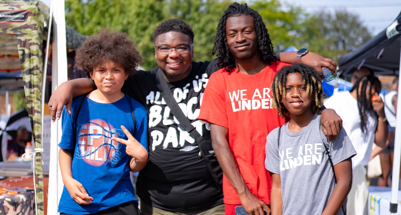 Students pose for a picture with Rep. Jarrells at the All of Us Block Party.