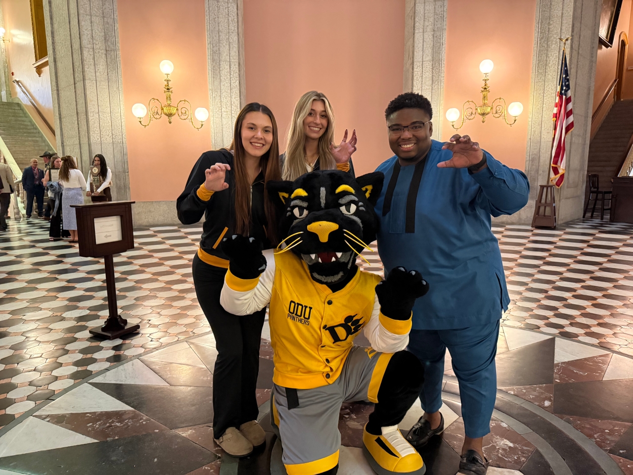 Rep. Jarrells poses with Ohio Dominican University students and mascot in the Statehouse rotunda.
