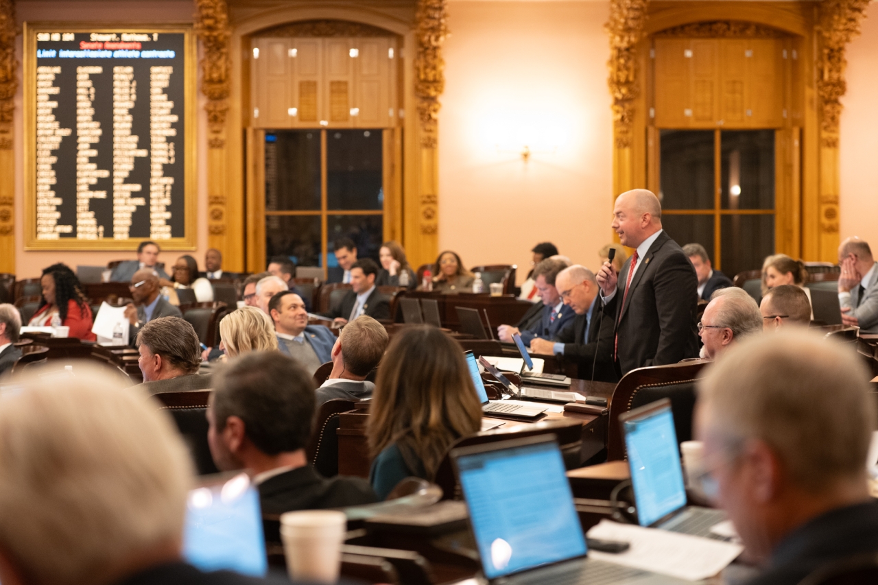 Representative Brian Stewart speaks about Senate Bill 56 during House Session