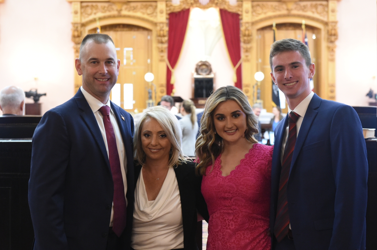 Rep. Miller on his swearing-in day with his wife Megan and their two children.