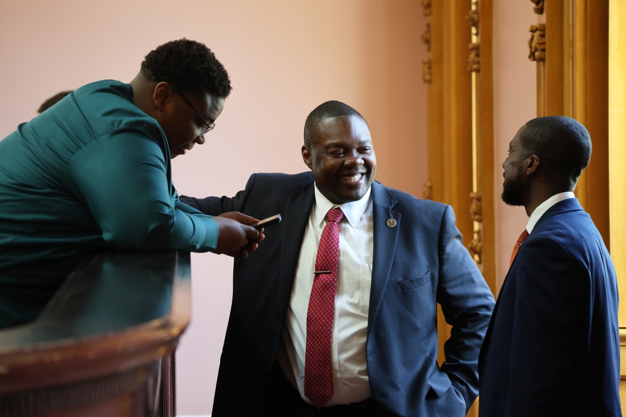 Rep. Rogers speaking with Rep. Jarrells and Rep. Blackshear on the House Floor