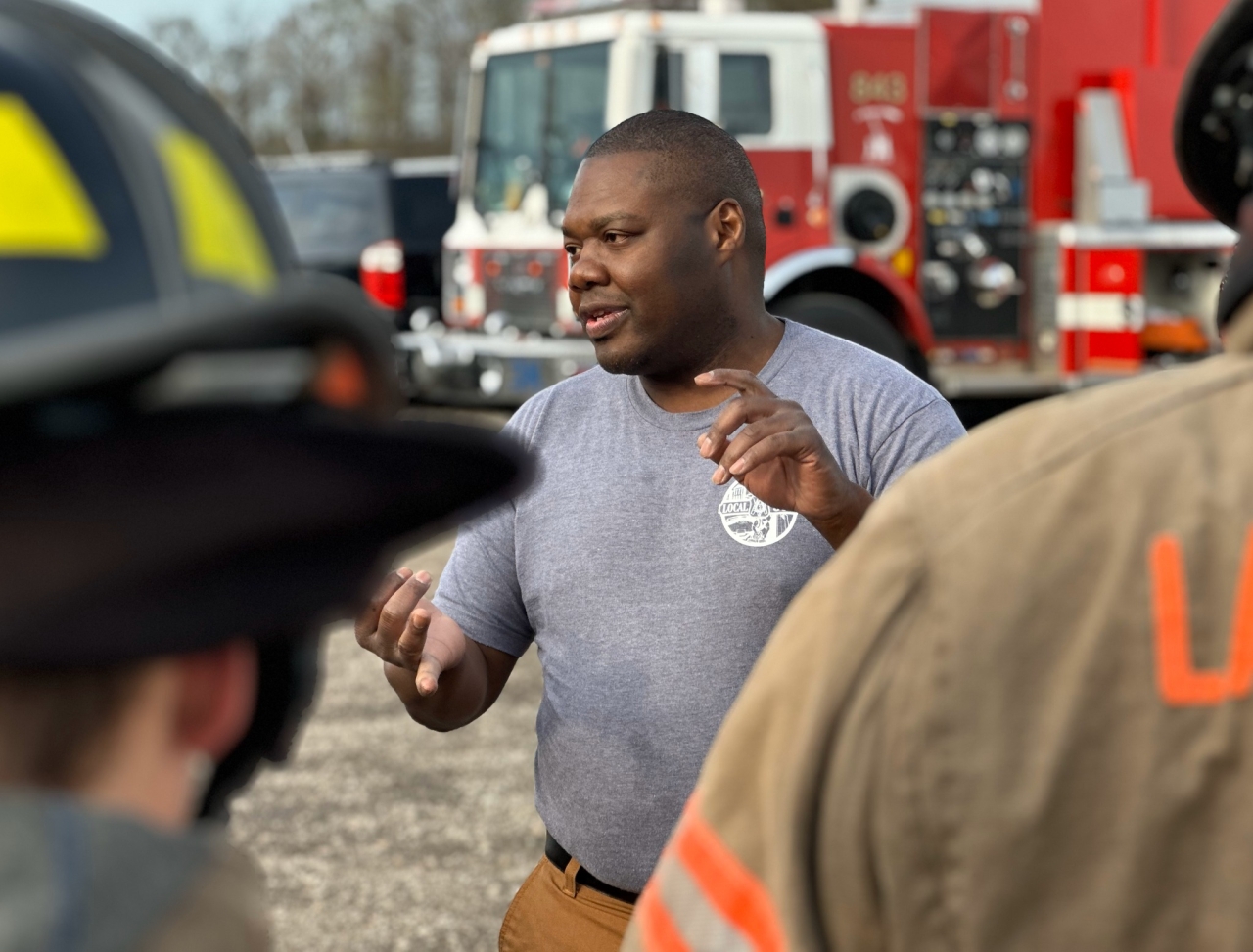 Rep. Rogers speaking with local firefighters