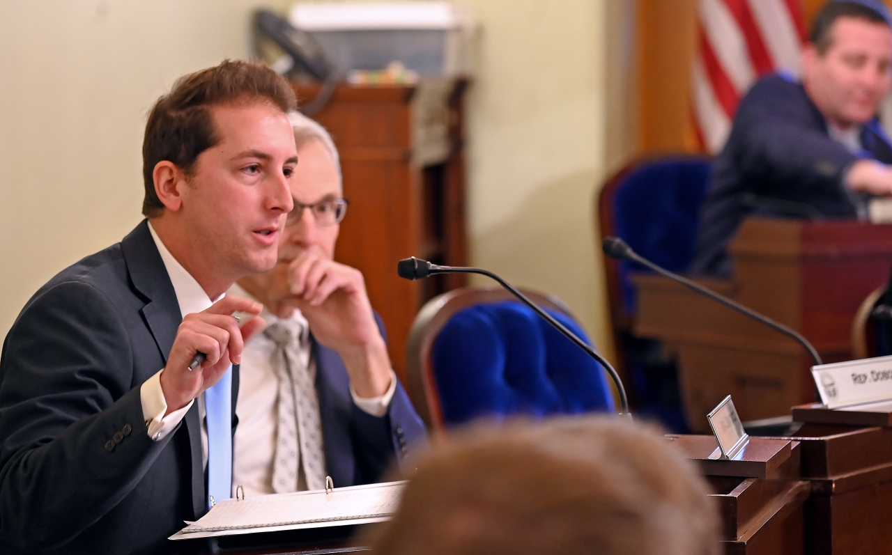 State Rep. Santucci ask questions of a witness in committee.
