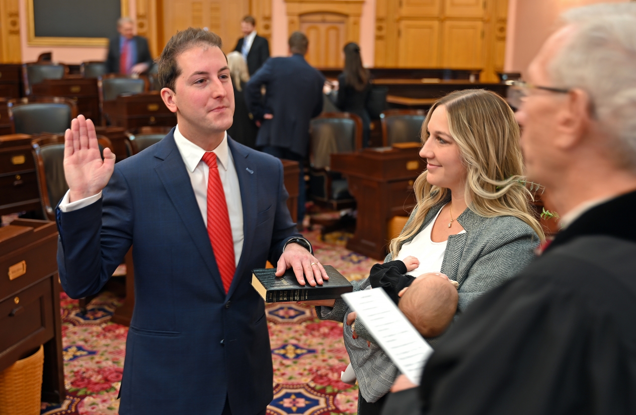 Rep. Santucci is sworn in with his wife during Opening Day of the 136th General Assembly.