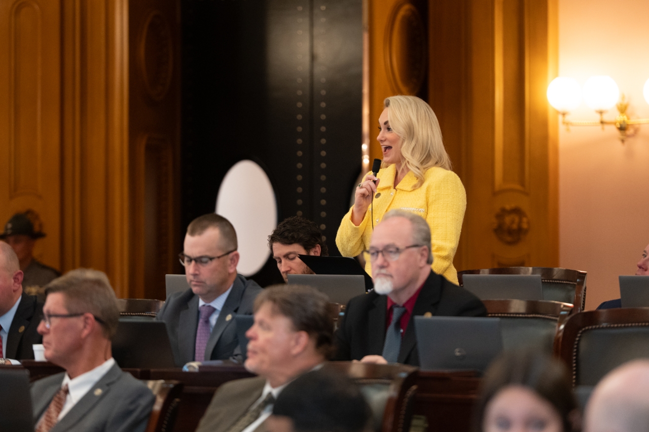 Rep. Miller speaks on the House floor during session.