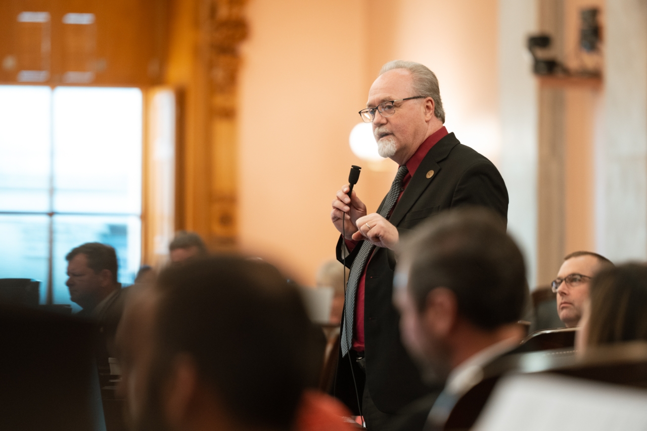 Rep. Daniels speaks on the House floor during session