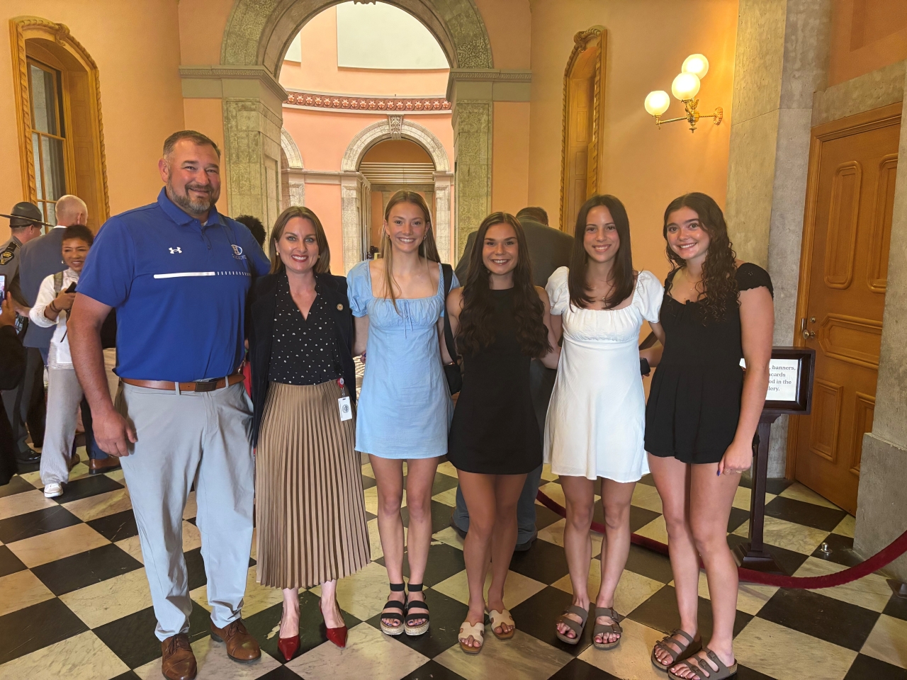 Rep. Lett celebrating the Hilliard Davidson Girls' track team placing first in the state championship