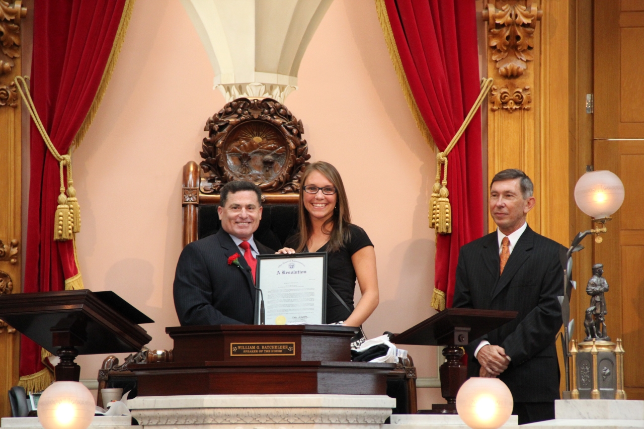 Rep. Perales presents a resolution to Micaela Powers,  who was named Division I Player of the Year in soccer
